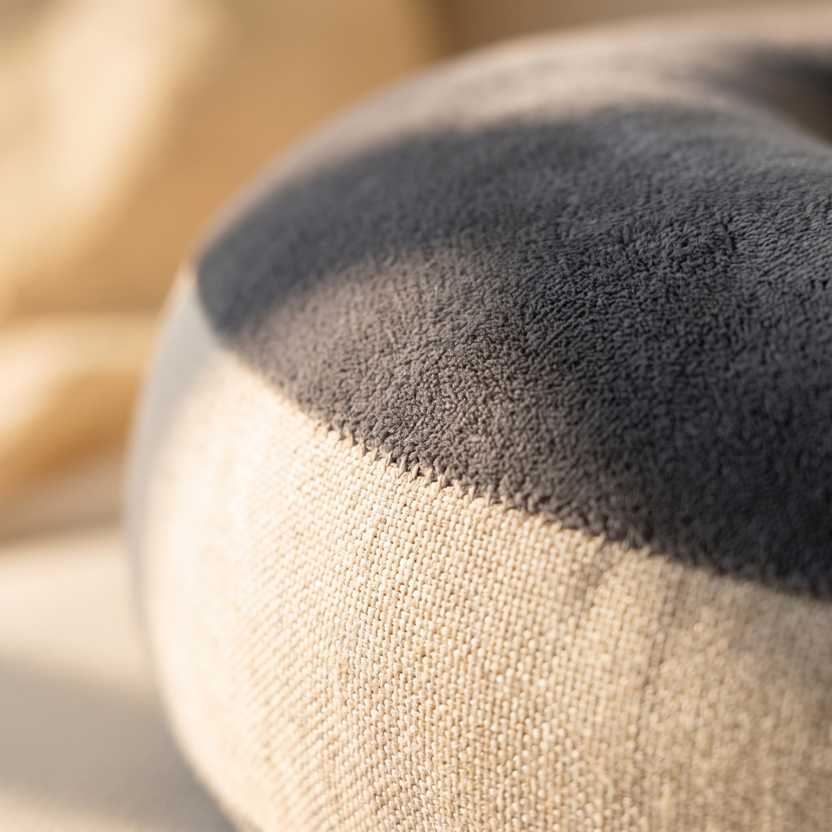 Close-up of the bead-filled bolster cover texture and seam
