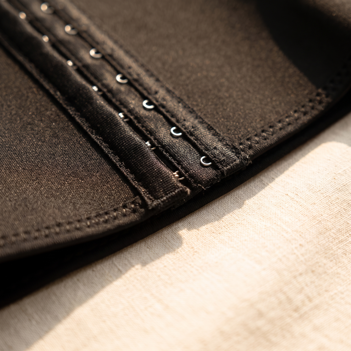 Close-up of the postpartum band fabric and adjustable fastening